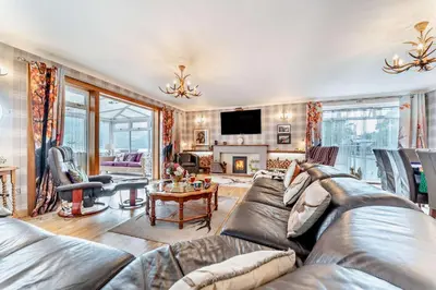 a living room with a couch and a table at 4 Bed in Lochgoilhead oc-j30107 in Carrick