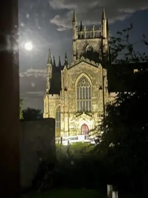 an old church with the light shining on it at Carvetii - Abbey View, 1st Floor Flat, City Centre in Dunfermline