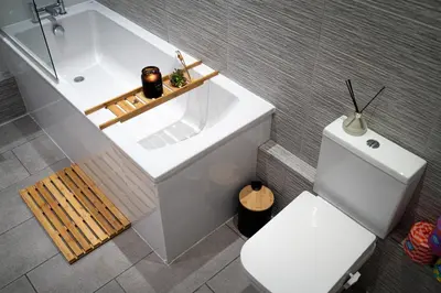 a bathroom with a white tub and a toilet at 20min train to Edinburgh, The Coorie Inn in Inverkeithing
