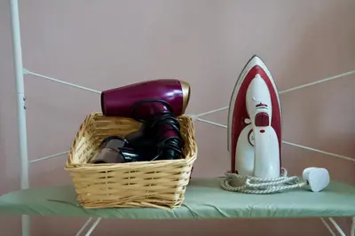 a basket on a shelf with a bottle of wine at 20min train to Edinburgh, The Coorie Inn in Inverkeithing