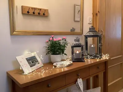 a dressing table with candles and lights on it at 2 Bed in Rosyth oc-r30512 in Rosyth