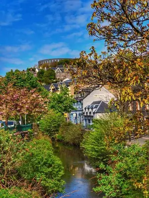 a river in a town with houses and trees at 17 Oban in Oban