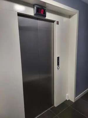 a elevator with a clock on top of it at The Maltings in Edinburgh
