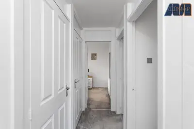 an empty hallway with white walls and white doors at Modern 3 Bed Home in Bathgate with Garden in Armadale