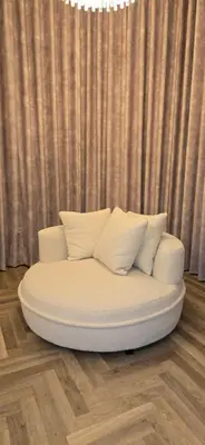 a white couch with pillows on a wooden floor at 2 Bedroom Sofa bed in livingroom Castle View 1st floor sleeps 6 in Edinburgh