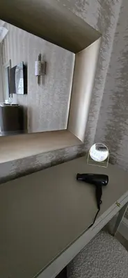 a counter with a mirror and a hammer on a table at 2 Bedroom Sofa bed in livingroom Castle View 1st floor sleeps 6 in Edinburgh