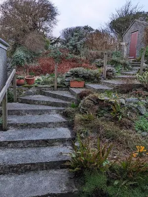 a set of stone stairs in a garden at Tigh Grianach in Port Charlotte