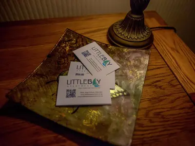 a table with two cards on top of a table at Littlebay Apartment in Oban