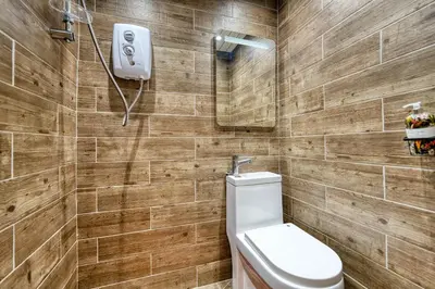 a bathroom with a toilet and a sink at Stylish 3-Bedroom Apartment in Central Glasgow in Glasgow