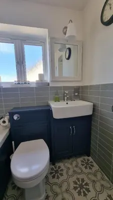 a bathroom with a toilet and a sink at Innisfail Edi - double room with private bathroom in Edinburgh
