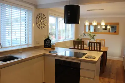 a kitchen with a sink and a counter top at Lovely Riverside Holiday Home in Callander