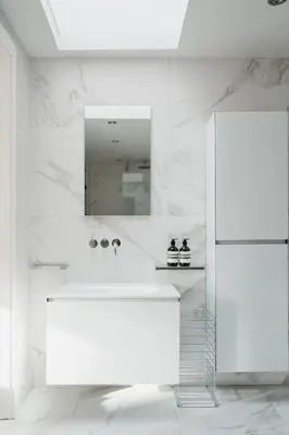 a white bathroom with a sink and a mirror at Prestigious Townhouse close to Princes Street in Edinburgh
