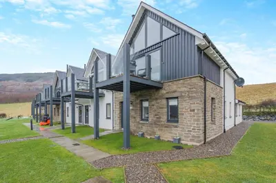 an image of a house with a building at 3 Bed in Fearnan oc-s29984 in Chesthill