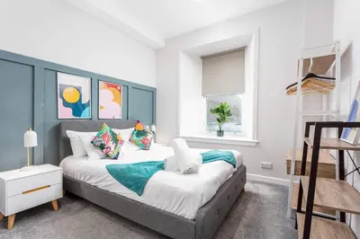 a bedroom with a large bed and a window at The Annick Suite No1 - Donnini Apartments in Irvine