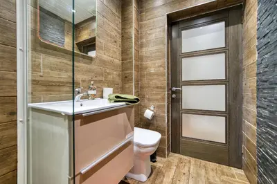 a bathroom with a sink and a toilet at Spacious 4 Bedroom Apt Near West End Glasgow in Glasgow