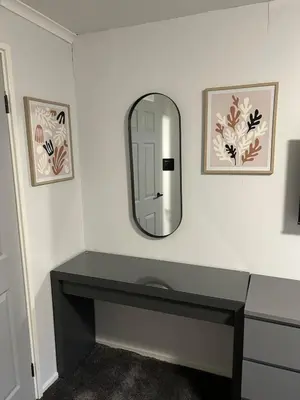 a bathroom with a sink and a mirror at Spacious 2 bedroom apartment, entire place in Greenock