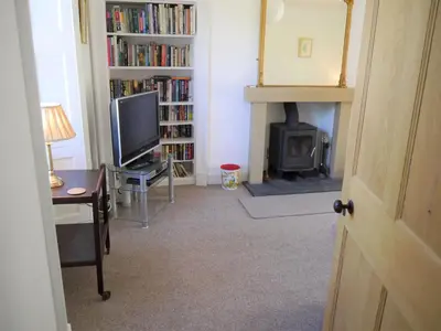 a living room with a television and a fireplace at Shinnel House in Thornhill