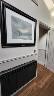 a painting of a plane hanging on a wall at Luxurious Cottage Machrihanish in Drumlemble