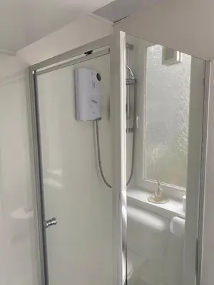 a bathroom with a shower and a window at 1 Bed Flat Near Edinburgh Castle in Edinburgh