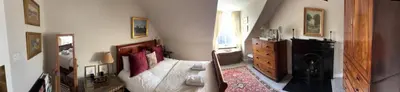 a living room with a white couch and a dresser at Stunning 2-Bedroom Georgian Flat, City Centre in Edinburgh