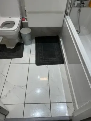 a bathroom with a toilet and a tile floor at The City Glasgow in Glasgow