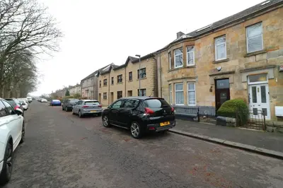 a black car parked on the side of a street at Signature - St James House in Abbotsinch