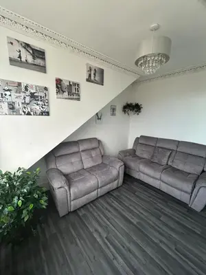 a living room with two couches and a couch at The Bay View Apartment in Gourock
