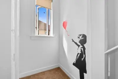 a wall stencil of a woman holding a heart at Grangeburn Residence - 2 bedroom home with parking in Falkirk