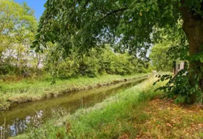 a river with trees on the side of it at Grangeburn Residence - 2 bedroom home with parking in Falkirk