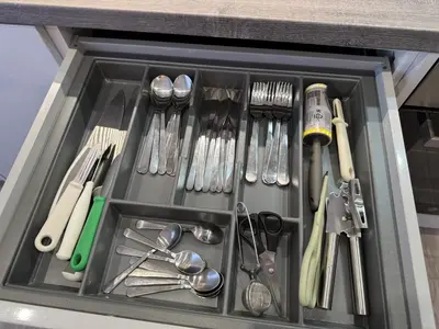 a drawer filled with utensils in a kitchen at Modern Flat in Glasgow City FREE Parking & Wifi in Glasgow