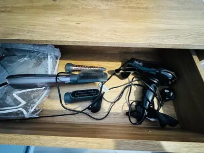a box with a gun and other items on a table at Modern Flat in Glasgow City FREE Parking & Wifi in Glasgow