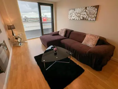 a living room with a couch and a table at Glasgow 2bd near Hydro SECC City Centre Great Location in Glasgow