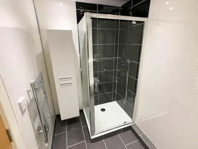 a shower with a glass door in a bathroom at Glasgow 2bd near Hydro SECC City Centre Great Location in Glasgow