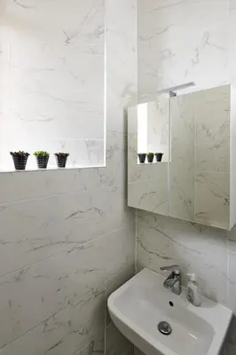 a white bathroom with a sink and a mirror at Swan Cove Apartment Gourock in Gourock