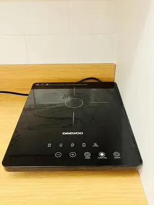 a tablet computer sitting on top of a wooden table at Ground Floor Entire Apartment Self Checkin in Crossgates