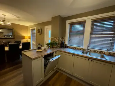 a kitchen with a sink and a counter top at Cochrane House in Stirling