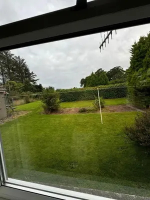 a view of a yard from a window at Holiday home, Carradale in Carradale