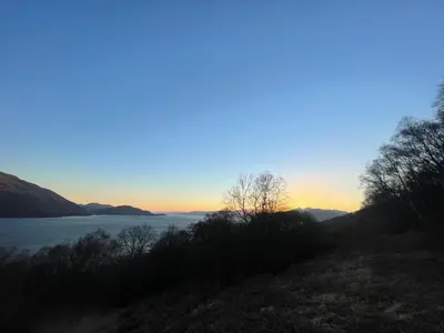 a view of a lake at sunset at Old Springwell Croft in Onich