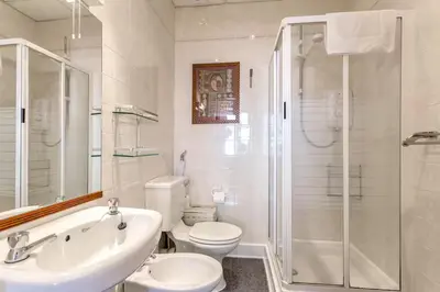 a bathroom with a sink and a toilet and a shower at Great Location! 2BD,2 Bath in Centre of Edinburgh in Edinburgh