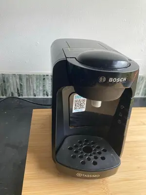 a black coffee maker sitting on top of a table at Garden Retreat in Nine Mile Burn