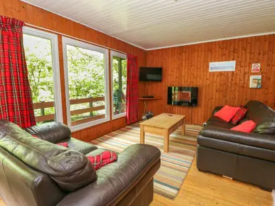 a living room with two leather couches and a table at Lodge 2 - 