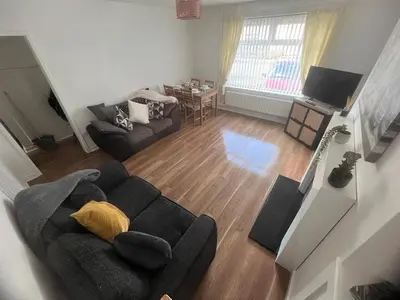 an overhead view of a living room with a couch at Mitchell House in Bellshill
