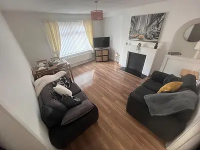 an aerial view of a living room with a couch at Mitchell House in Bellshill