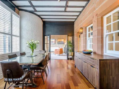 a dining room with a table and chairs at Piersland Mews in Troon