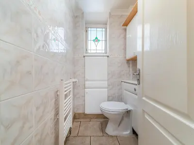 a bathroom with a toilet and a window at Torland in Dalserf