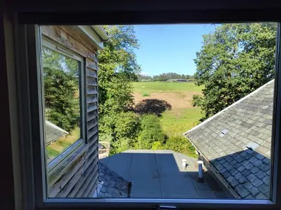 a view of a porch from a window of a house at Mulberry Lodge Guest Suite - luxurious accommodation on West Highland Way in Drymen