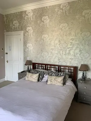 a bed with two pillows on it in a bedroom at Creity Hall Guest House in Doune