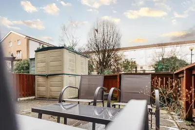 a group of chairs and a table on a patio at Spacious 3 Bed Home in Glasgow City With Free Parking in Glasgow