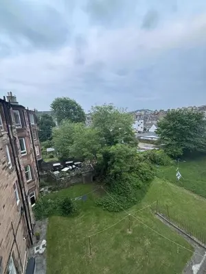 an aerial view of a yard with trees and buildings at Bright Top Floor 2BR Apartment in Morningside, Easy City Centre Links, Close to University and Royal Hospital in Edinburgh