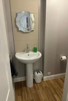 a bathroom with a sink and a mirror on the wall at Charming Snug Loft Room, Room 4, Beautiful Connel near Oban in Connel